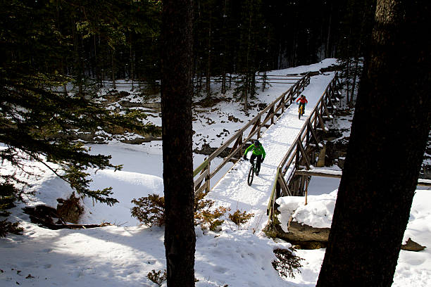 istock Winter Snow Biking Couple 472061017