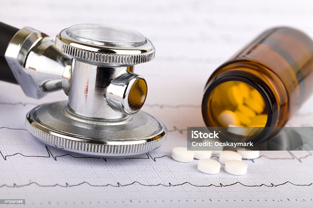 Health care Picture of a whitel pills capsules and stethoscope Medicine Stock Photo