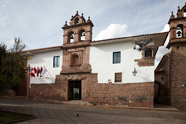 Blue balconies with flags in a colonial building of Cusco, Peru