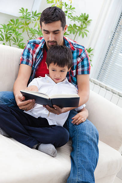 istock Father and son at home 472063925