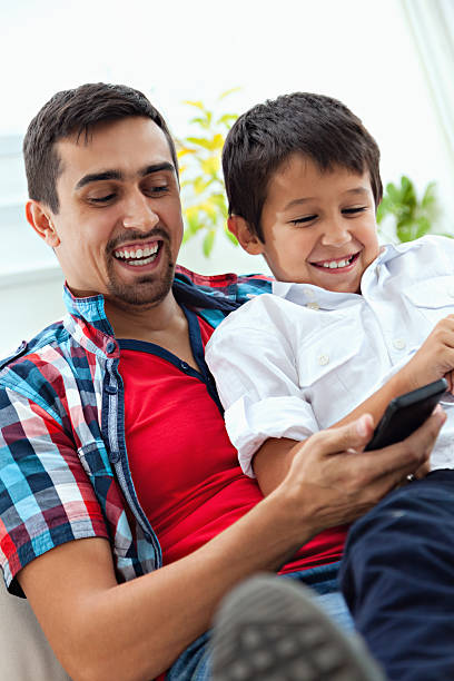 istock Father and son at home 472064001