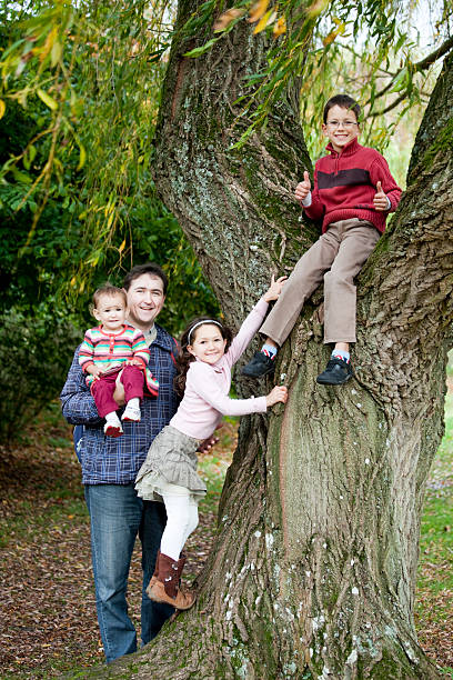 istock Happy family walk in the park 472064359