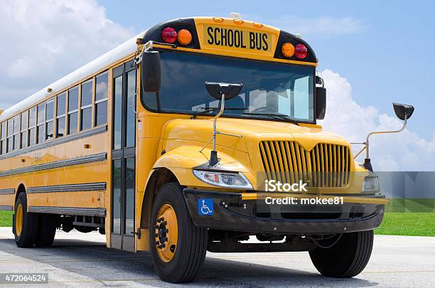 School Bus On Blacktop With Clean Sunny Background Stock Photo - Download Image Now - School Bus, Bus, Education