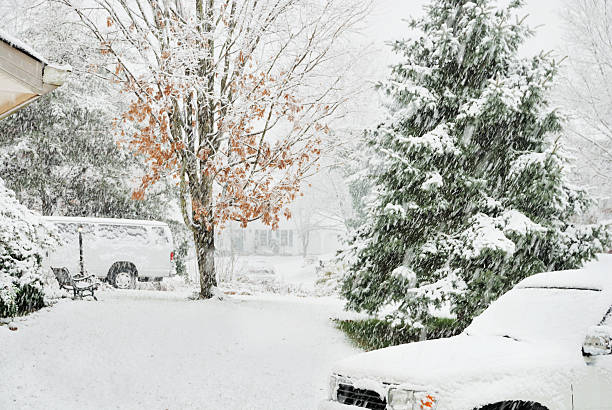 istock Snowstorm covers car with snow 472065223
