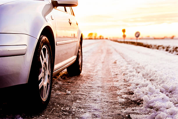 Gomel, Belarus - January 26, 2017: Volkswagen Polo Car Sedan Parking On A Snowy Roadside Of Country Road On A Background Of Dramatic Sunset Sky At Winter Season. Altered Sunset Sunrise Sky.