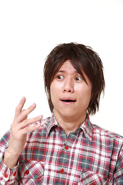 istock young Japanese man shocked 472067524
