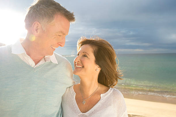 istock Happy mature couple at the beach 472067615