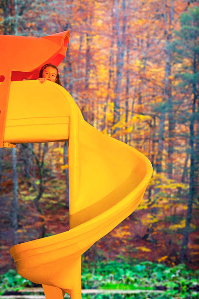 istock Cute Little girl on slide 472067993