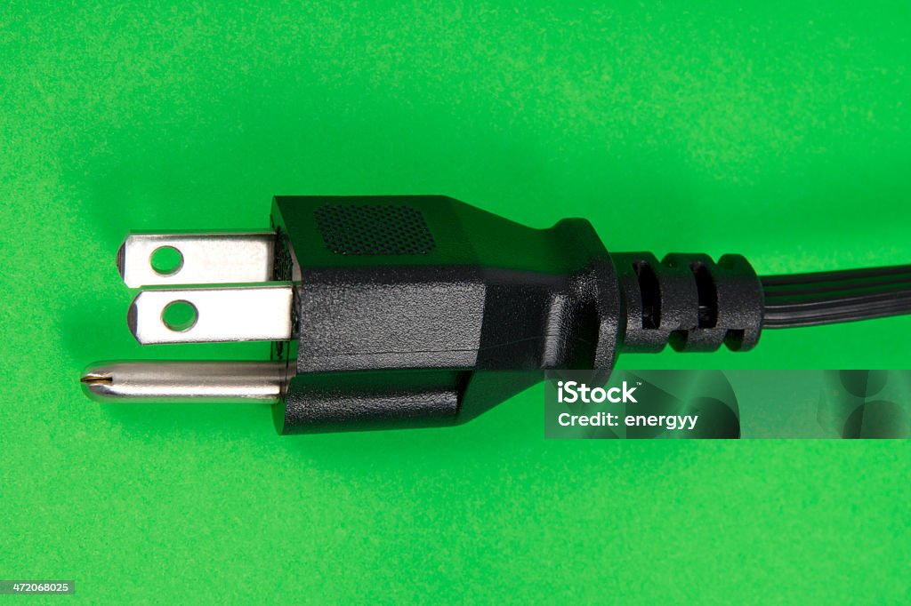 Conector eléctrico en verde - Foto de stock de Color negro libre de derechos