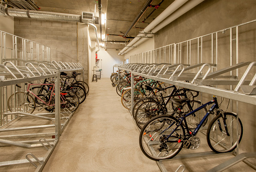 Secure bicycle storage in the basement of a parking garage.