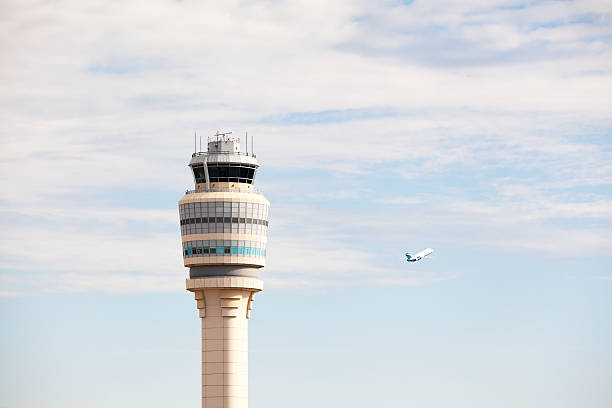 istock Atlanta's Hartsfield-Jackson Airport Control Tower with Plane Taking Off 472069051