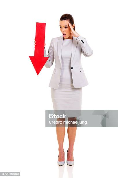 Young Businesswoman Holding Red Arrow Stock Photo - Download Image Now - 2015, Adult, Adults Only