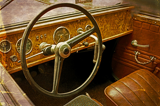 Old postcard with driver's cockpit of a vintage classic car. Vintage processed.