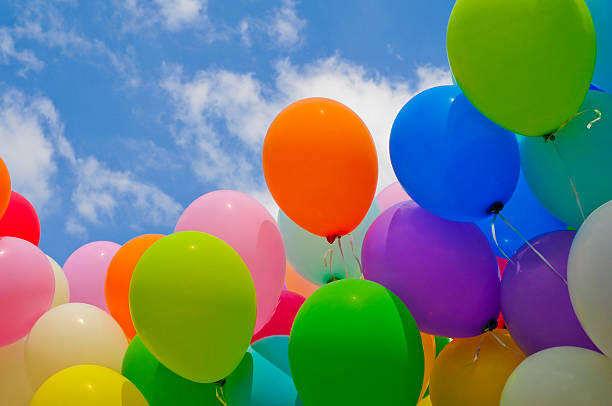istock Colorful balloons against a blue sky 472071463