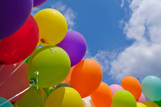 istock Colorful balloons in front of a blue sky 472071499