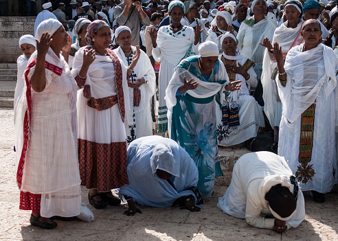 Jerusalem, Israel - October 31, 2013: Ethiopian Jewish women kneel in pray at the Sigd in Jerusalem, Israel. The Sigd is an annual holiday of the Ethiopian Jews.
