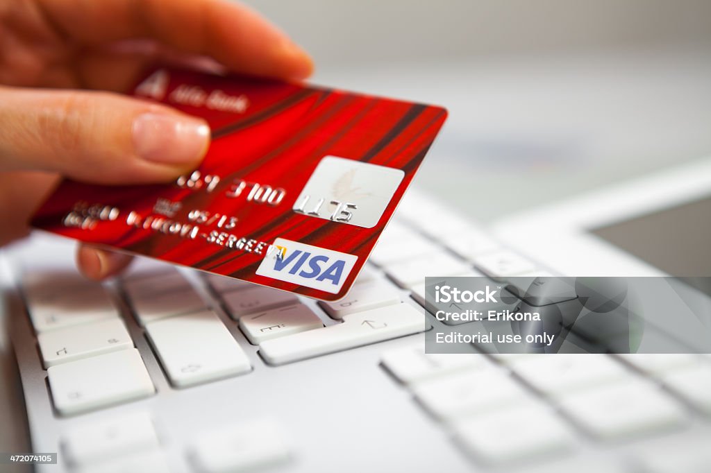 Visa credit cart Nizhnevartovsk, Russia - November 29, 2012: Close-up Visa credit cart on Apple keyboard. Banking Stock Photo