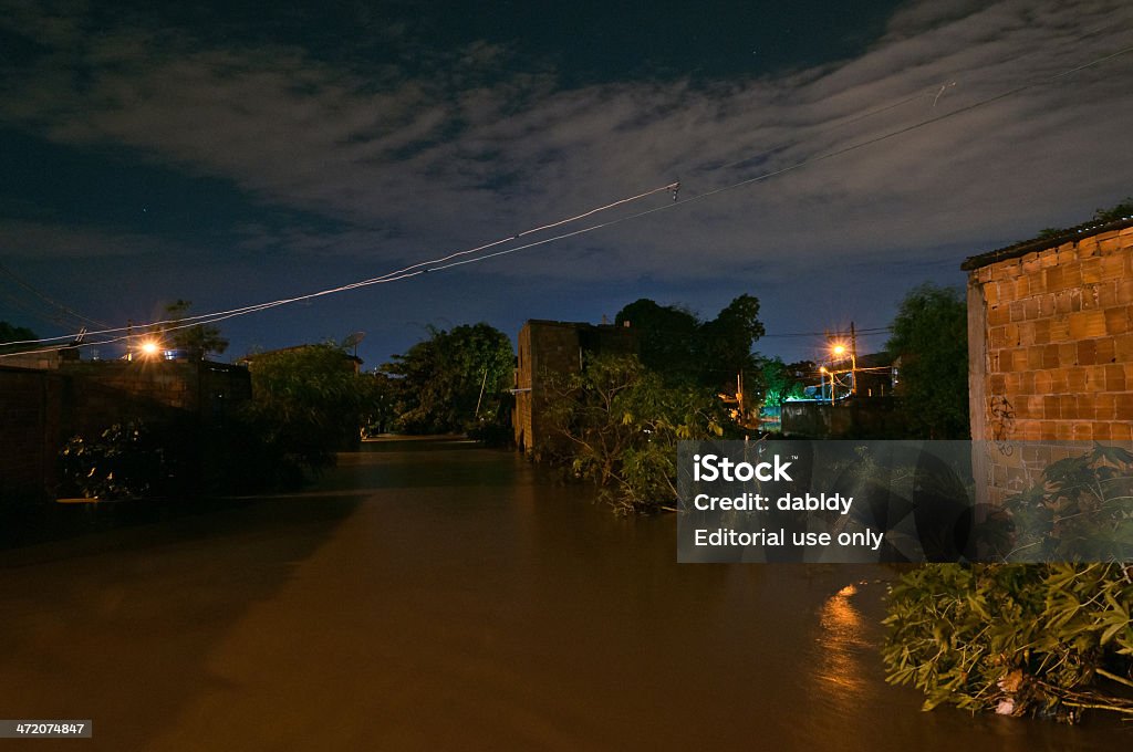 Flood Nova Iguacu, Rio de Janeiro, Brazil - December 6, 2013: Poor living area flooded after heavy rain on 6th December, 2013. The water level of local river got few meters higher, many houses were flooded. Accidents and Disasters Stock Photo