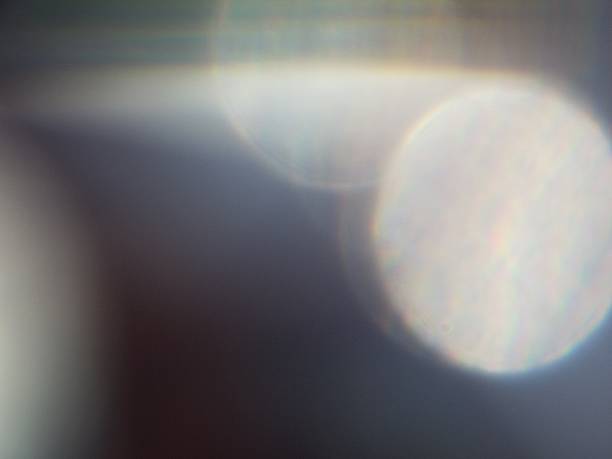 istock White Bokeh Spots on Dark Gray Background 472075264