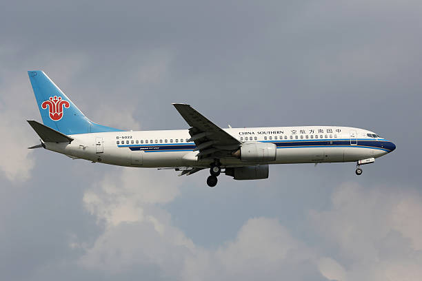 Shanghai, China - September 19, 2013: A China Southern Boeing 737-800 with the registration B-5022 approaches Shanghai Airport (SHA) in China. China Southern is China's largest airline. It operates with 444 aircraft and carried 81 million passengers in 2012.