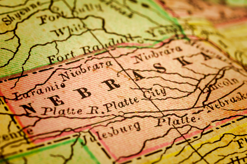 Nebraska on a 1880's map. Nebraska is a state that lies in both the Great Plains and the Midwestern United States. Its state capital is Lincoln. Its largest city is Omaha, which is on the Missouri River. Selective focus and Canon EOS 5D Mark II with MP-E 65mm macro lens.