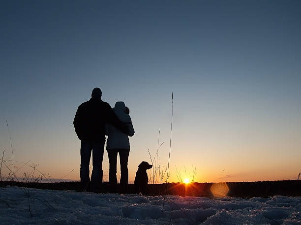 istock Loving couple with dog at sunset 472076248