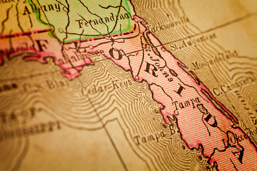 Florida on a 1880's map. Florida is a state in the southeastern region of the United States, bordered to the west by the Gulf of Mexico, to the north by Alabama and Georgia, to the east by the Atlantic Ocean, and to the south by the Straits of Florida. Selective focus and Canon EOS 5D Mark II with MP-E 65mm macro lens.