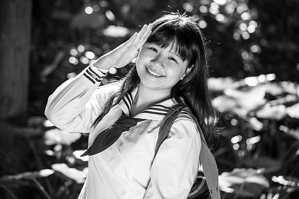 istock Female college student smiling outdoors 472076407