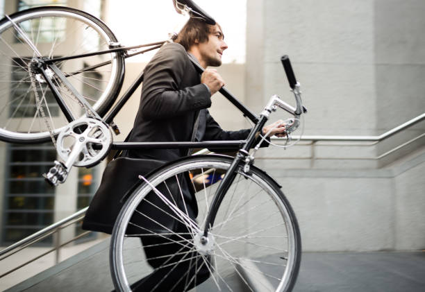 istock Businessman with Bicycle on Escalator 472076711
