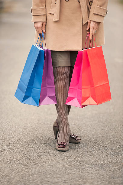 istock Woman Walking with Shopping Bags 472076792
