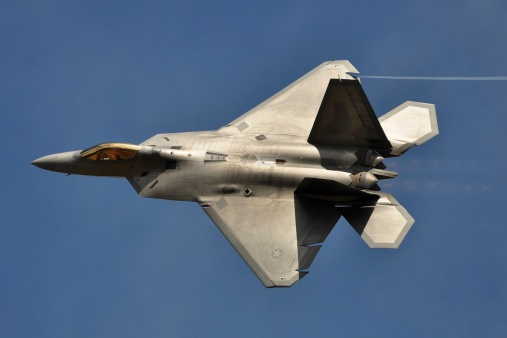 Fairford, United Kingdom - July 17, 2010: A US Air Force F-22 Raptor stealth fighter passes by at an airshow in the United Kingdom.