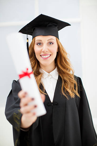 istock Young Cheerful College Female Graduate. 472077927