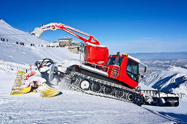 istock Red snowplow machine in ski station 472078101