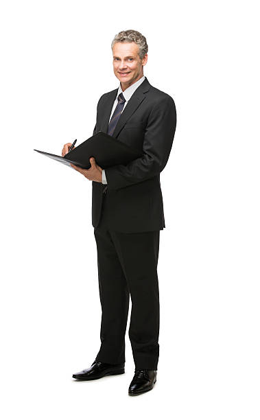 istock Mature businessman signing file 472079387