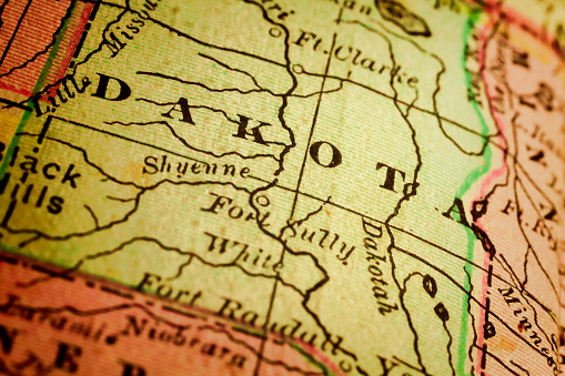 Dakota on a 1880's map. The Dakotas is a collective term for the U.S. states of North Dakota and South Dakota. It has been used historically to describe the Dakota Territory, Selective focus and Canon EOS 5D Mark II with MP-E 65mm macro lens.