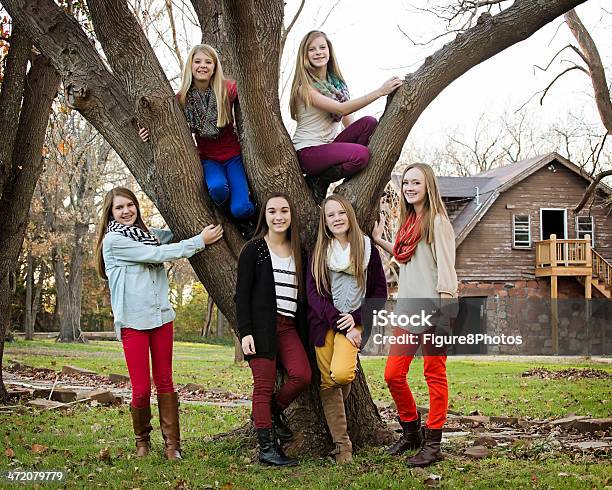 Preteen Girls In Front Of Tree Stock Photo - Download Image Now - Teenage Girls, 12-13 Years, Adolescence