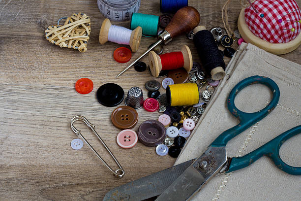 istock Spools of threads buttons needle for sewing vintage retro style 472079892