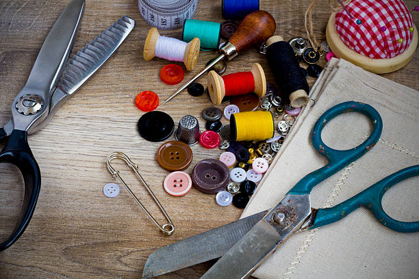 istock Spools of threads buttons needle for sewing vintage retro style 472079896