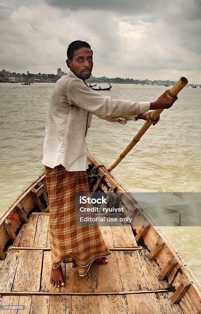 Rower Old Dhaka, Bangladesh - September 14, 2007: Man rowing in the small boat on Buriganga river in Dhaka, Bangladesh 2015 Stock Photo