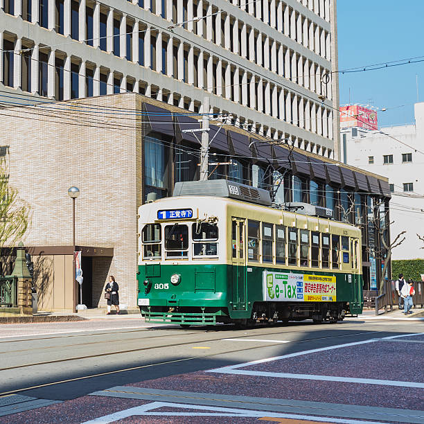 Streetcar in Nagasaki Nagasaki, Japan - November 14 2013: Nagasaki served by 4 tram lines, operated by Nagasakic Electric Tramway, provide easy access to most city's main attractions and run every 5-8 minutes huis ten bosch stock pictures, royalty-free photos & images