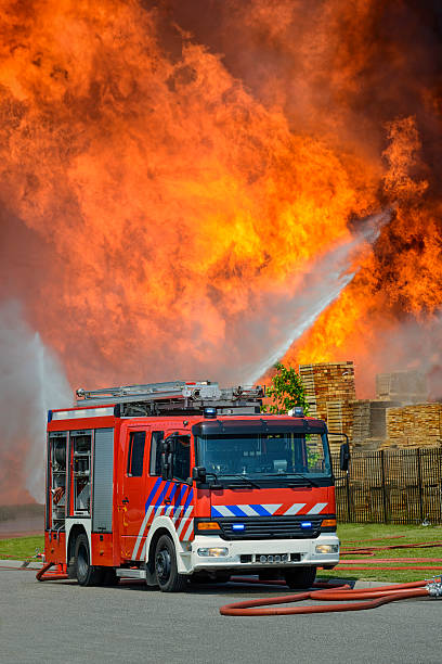istock Fire Truck in front of huge flames 472081851