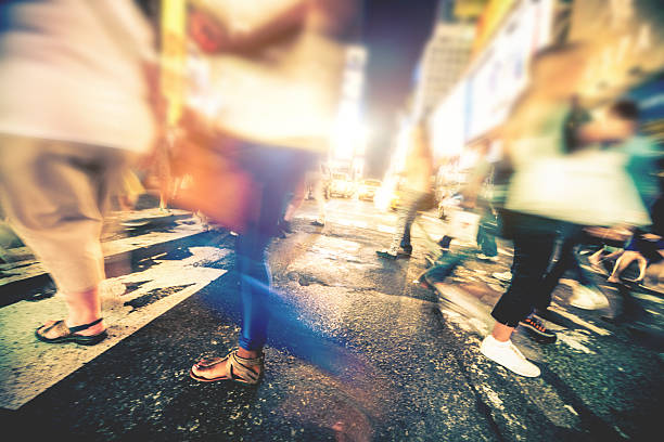 istock People crossing in Times Square 472082041