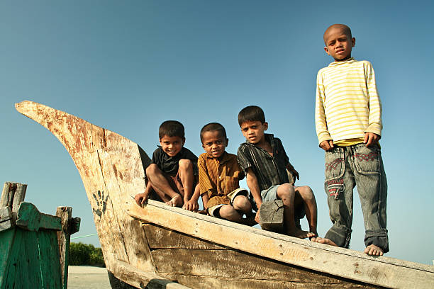 Four Boys on a Boat stock photo