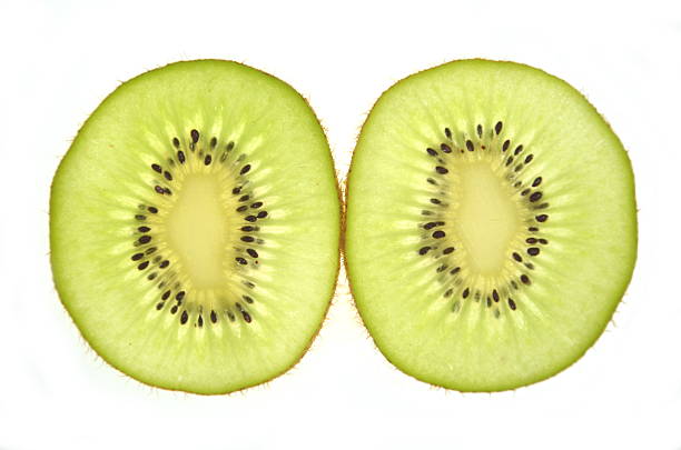 istock slices of kiwi isolated on white background 472082744