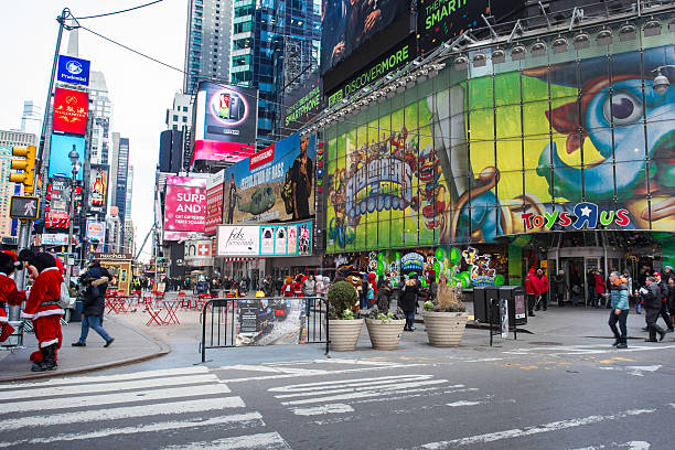 Times Square NYC New York City, New York, USA - December 13, 2013: Street view of Broadway at Times Square in New York City on December 13, 2013. Times Square is a busy entertainment district well known for its annual New Years Eve celebration. times square new years eve stock pictures, royalty-free photos & images