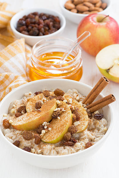 istock oatmeal with apples, raisins, cinnamon and ingredients 472083632
