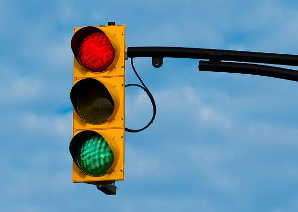 A Stoplight taken with both the red and green lights lit.