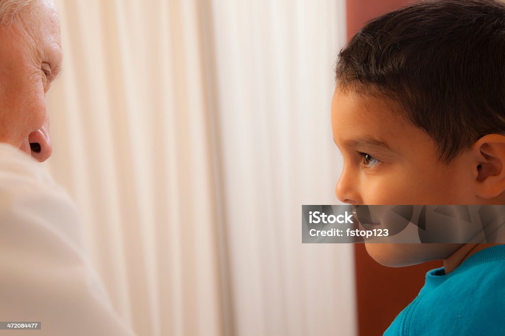 Medical: Latin boy in doctor's office on exam table. Little boy in doctor's office receiving medical exam.  6-7 Years Stock Photo