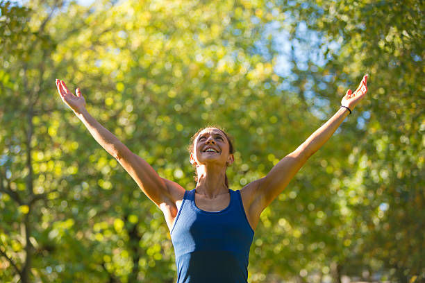istock Woman With Arms Up 472084731