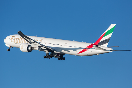 Zürich, Switzerland - December 10, 2013: Emirates Airline Boeing 777-300ER departing Zurich airport.